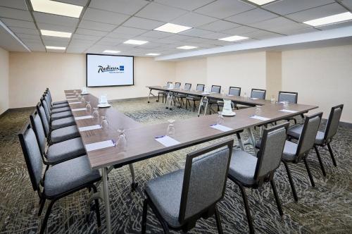 a large conference room with a long table and chairs at Radisson Blu Toronto Downtown in Toronto