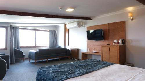 Ένα ή περισσότερα κρεβάτια σε δωμάτιο στο Varyant Hotel