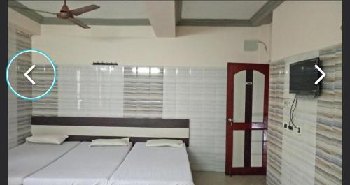 Postel nebo postele na pokoji v ubytování Hotel mim Grand