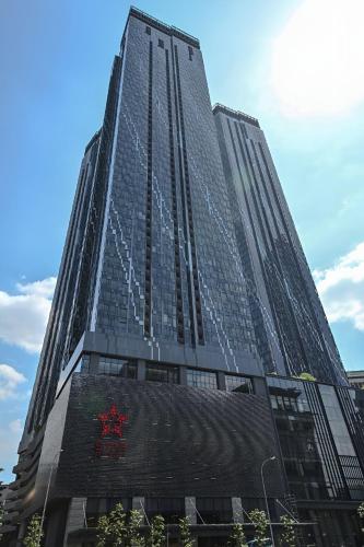 a tall building with a sign on the side of it at Suites Apartment By Star Residences in Kuala Lumpur