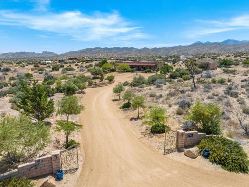 a dirt road in the middle of a desert at Navigate Stays Pioneertown Retreat w Hot Tub in Pioneertown