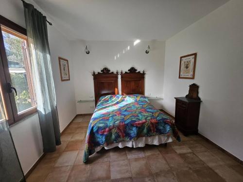 Ένα ή περισσότερα κρεβάτια σε δωμάτιο στο Villa Domo Sardo - Masone pardu