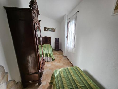 Ένα ή περισσότερα κρεβάτια σε δωμάτιο στο Villa Domo Sardo - Masone pardu