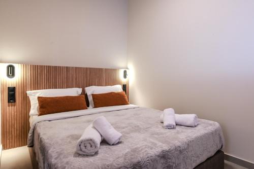 a bedroom with a large bed with towels on it at Preveza Central Stay in Preveza