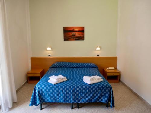 Ένα ή περισσότερα κρεβάτια σε δωμάτιο στο Hotel Jole