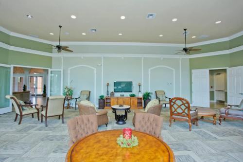 a living room with a table and chairs at Ground Floor Gathering up to 9 guests BL387 in Kissimmee