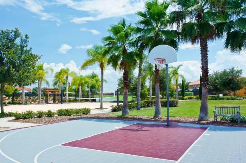 a basketball hoop in a park with palm trees at Ground Floor Gathering up to 9 guests BL387 in Kissimmee