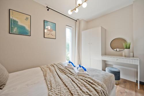 Letto o letti in una camera di Apartamenty Wyspa BlueApart Jastarnia