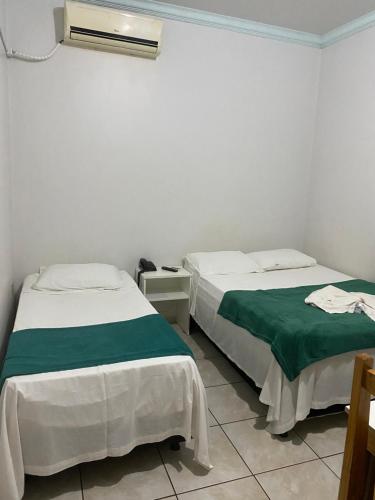 Postel nebo postele na pokoji v ubytování Oriente Hotel Outlet