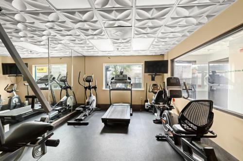 a gym with treadmills and elliptical machines at Wingate by Wyndham Humble/Houston Intercontinental Airport in Humble