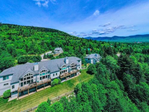 an aerial view of a large house on a hill at SH5 Luxurious Stone Hill Townhome in Carroll