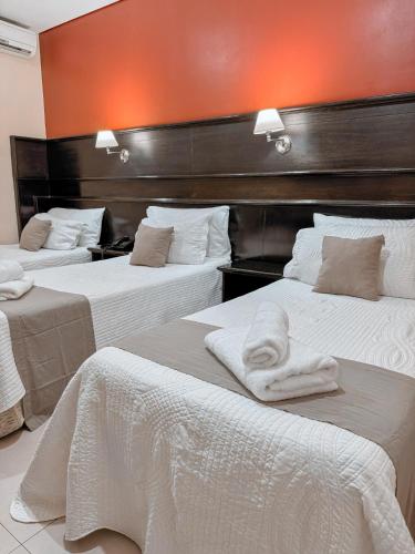 Postel nebo postele na pokoji v ubytování Hotel Ciudad
