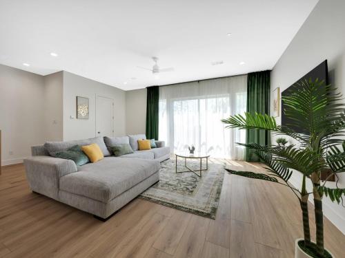 a living room with a couch and a table at Uptown Escape l Stylish Stay near Downtown Dallas in Dallas