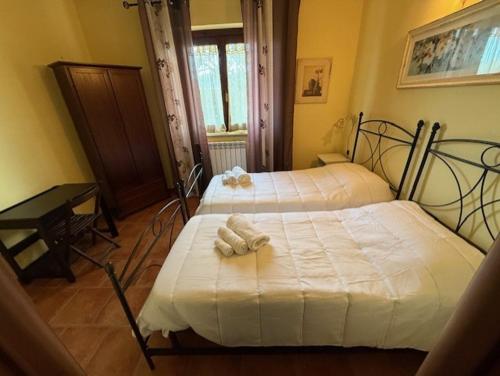 Postel nebo postele na pokoji v ubytování Dimora della Jana