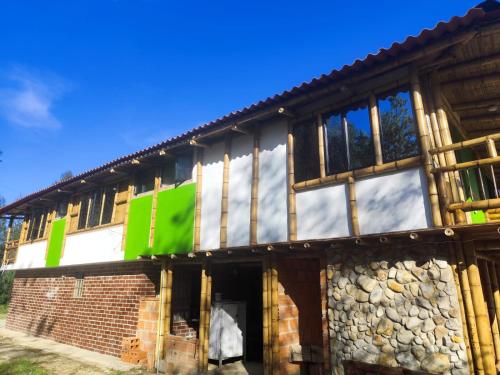 a building under construction with the front of it at El Chalet Ecoposada in Sotaquirá