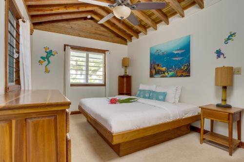 a bedroom with a bed and a ceiling fan at Beachfront Villa Deep Pool Sleeps 6 Private Suite in Maya Beach