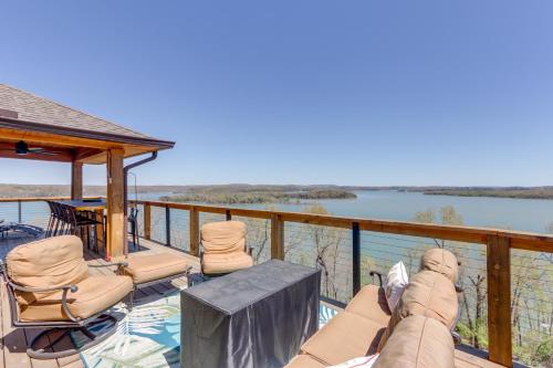 a deck with chairs and a view of the water at The Best Views on Beaver Lake! Home with Deck and BBQ in Rogers
