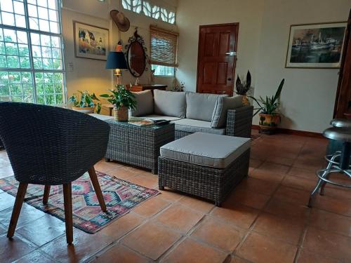 a living room with a couch and a table at Lovely 2 Bedrrom Casita with Bay view in Zihuatanejo