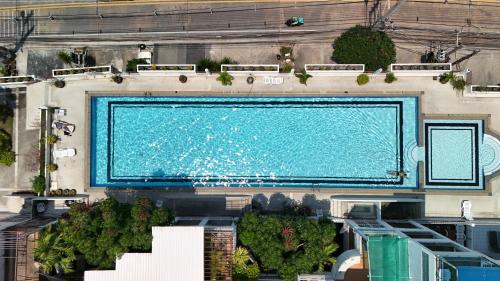 an overhead view of a large swimming pool at Grosvenor House - Olympic Pool - Pattaya in Pattaya South