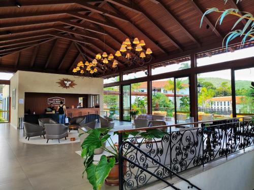 a lobby of a house with a living room at Resort QSB - Um novo padrão de conforto e lazer no coração da cidade in Pirenópolis
