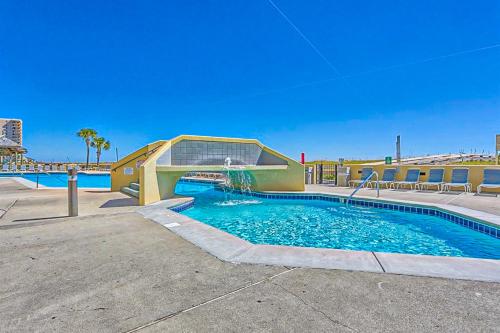 a swimming pool with a slide in a building at Phoenix VI 206 in Orange Beach