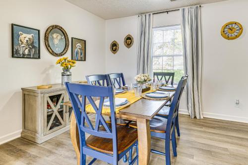 a dining room with a wooden table and blue chairs at 9 Mi to Dtwn Indianapolis Family-Friendly Home! in Indianapolis