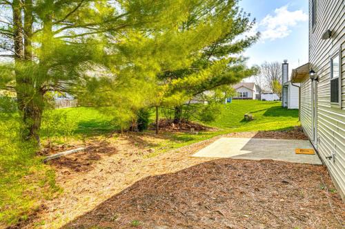 a driveway leading to a house with a tree at 9 Mi to Dtwn Indianapolis Family-Friendly Home! in Indianapolis