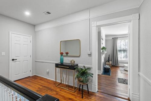 a living room with a mirror on the wall at Luxury 1 Bed Downtown Columbia Upstairs in Columbia