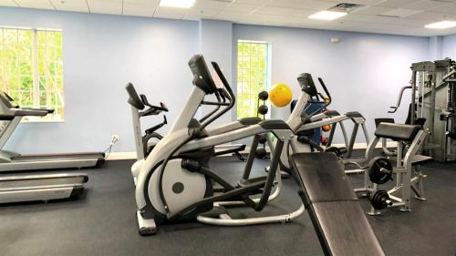 a gym with several tread machines in a room at 809 Mariners Club in Key Largo