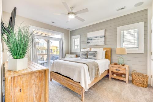 a bedroom with a bed and a ceiling fan at Surf City House about 400 Ft Walk to Beach with Decks! in Surf City