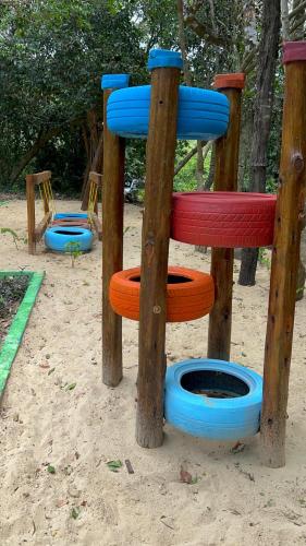 a playground with several different colored frisbees at Bruma Homes in Ponta do Ouro