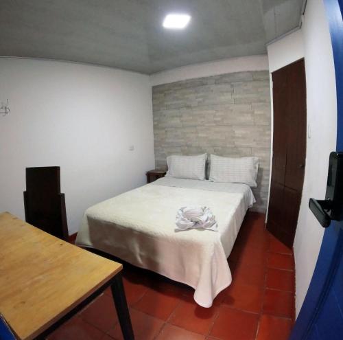 Postel nebo postele na pokoji v ubytování Ulucaho Hostel
