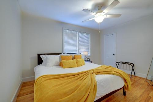 a bedroom with a bed with a yellow blanket on it at 2 Bed Charming Home Cayce W Columbia in Cayce