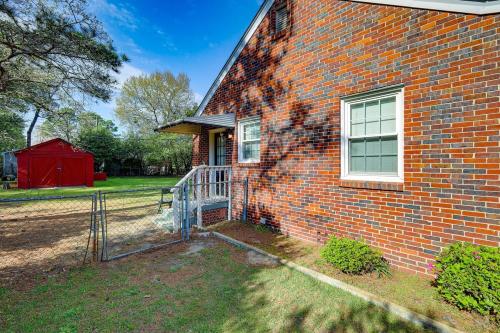 a brick house with a window and a fence at 2 Bed Charming Home Cayce W Columbia in Cayce