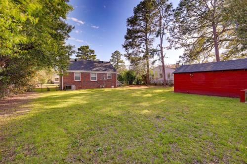 a large yard with a red barn and trees at 2 Bed Charming Home Cayce W Columbia in Cayce