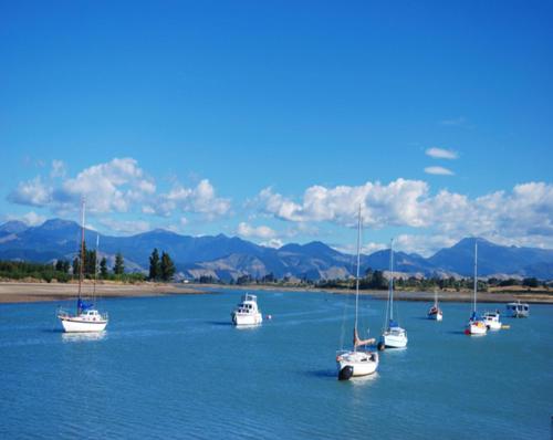 a group of boats sitting in the water at Apple Valley West - Mahana in Mahana