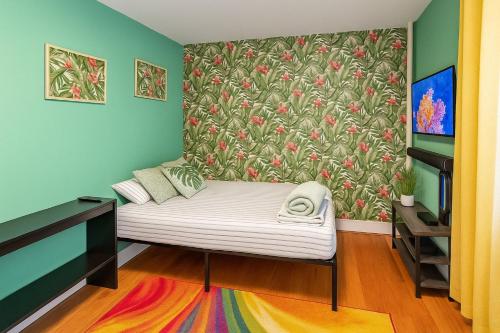 a bedroom with a bed with a floral wallpaper at Tropical style room in New York
