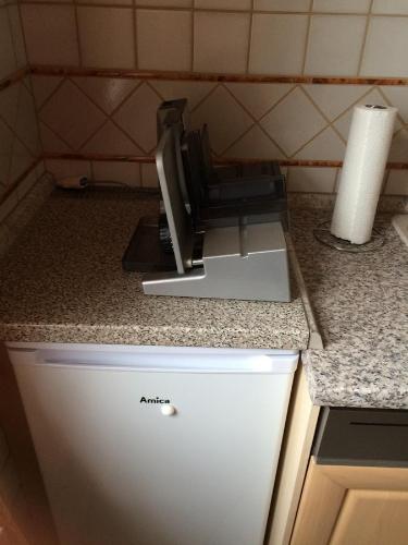 a kitchen counter with a appliance on a counter top at Pension Hönel-Hof Bad Schandau in Bad Schandau