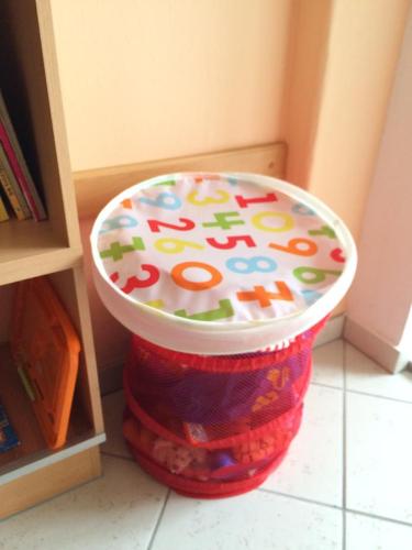 a colorful trash can sitting in a corner of a room at Pension Hönel-Hof Bad Schandau in Bad Schandau