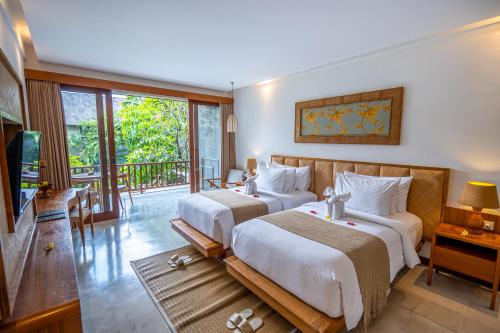 Cama o camas de una habitación en Purana Suite Ubud