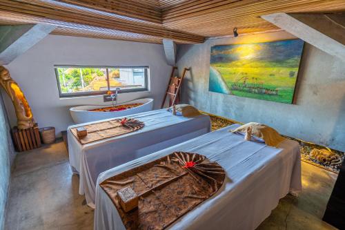 Cama o camas de una habitación en Purana Suite Ubud