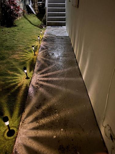 a row of lights on the side of a building at Casa playera in Ceiba