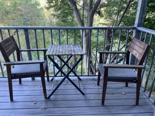 two chairs and a table on a porch at Buchan Motel in Buchan