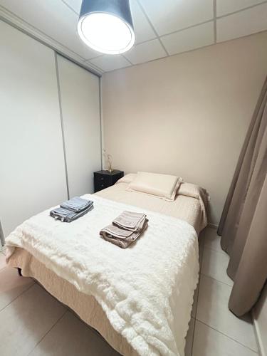 Ένα ή περισσότερα κρεβάτια σε δωμάτιο στο Departamento ISABELLA