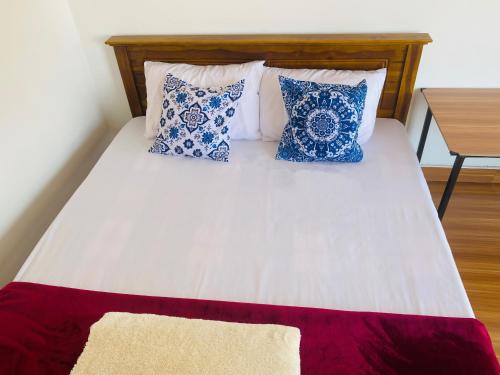 Postel nebo postele na pokoji v ubytování MK Guest House