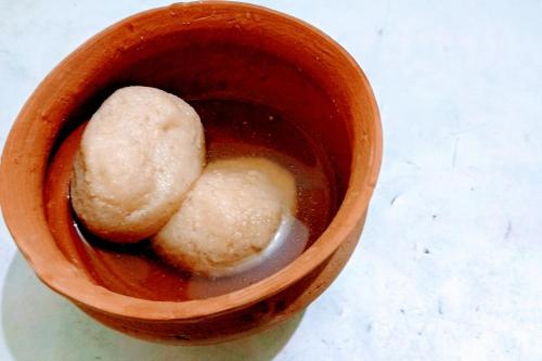 a cup with two pieces of food in it at Hotel O Akash Ganga Park Circus in Ballygunge