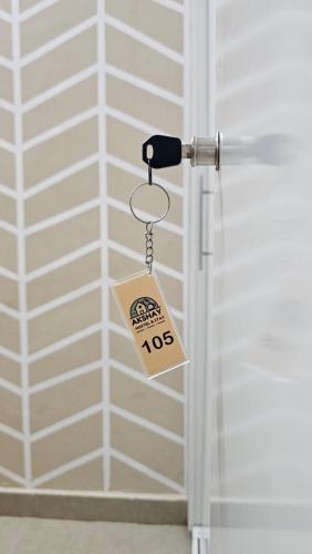 a door tag hanging from a door knob at Akshay BnB & HomeStay in Lucknow