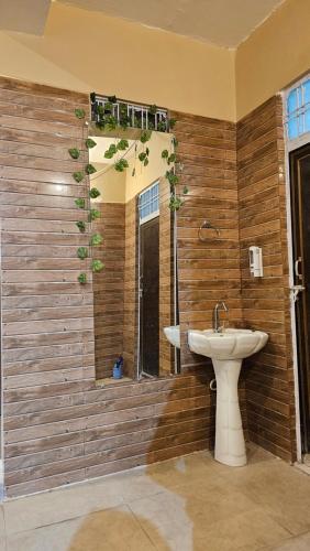a bathroom with a sink and a window at Akshay BnB & HomeStay in Lucknow