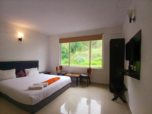 Postel nebo postele na pokoji v ubytování Veu Munnar Retreat - Valley View Rooms