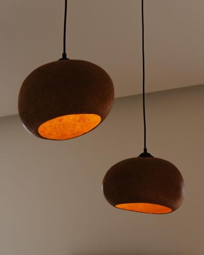 two lights are hanging from a ceiling at Theros Villas Naxos in Plaka